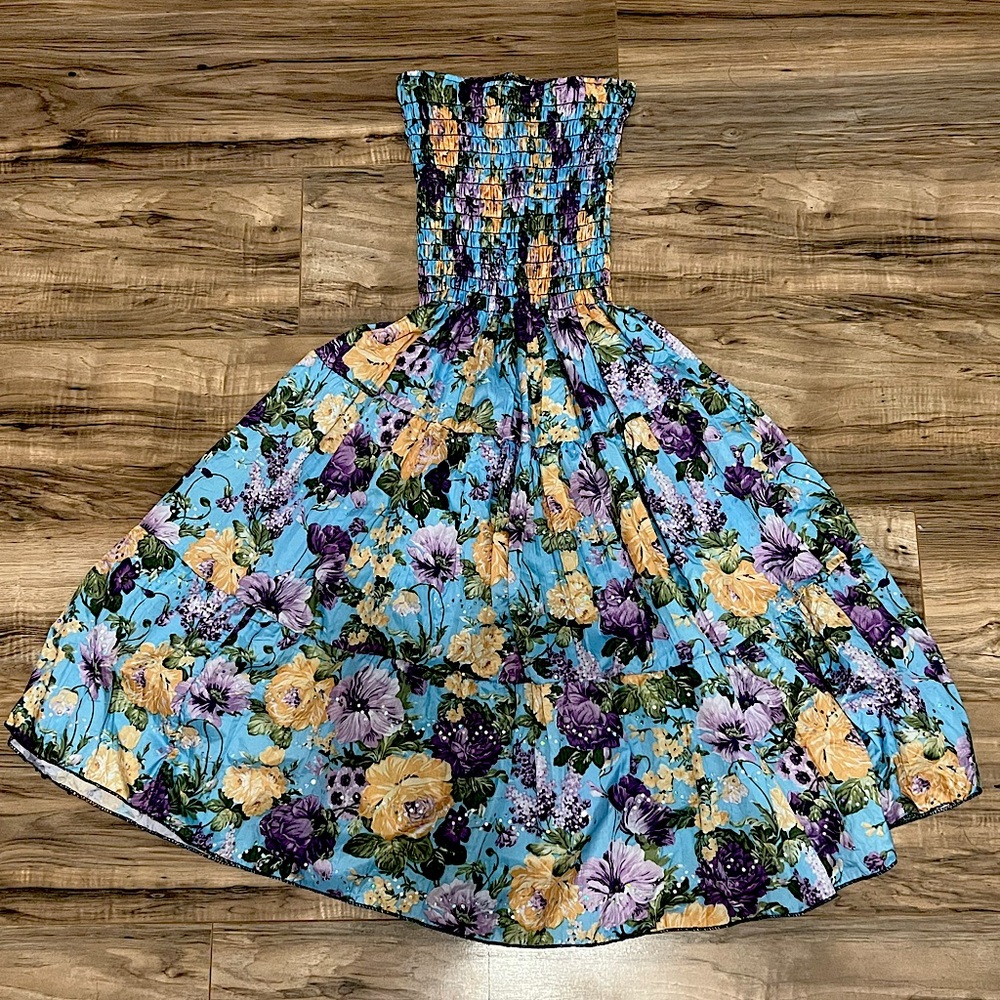 A cute, strapless, multicolore, floral summer dress. perfect for vacation